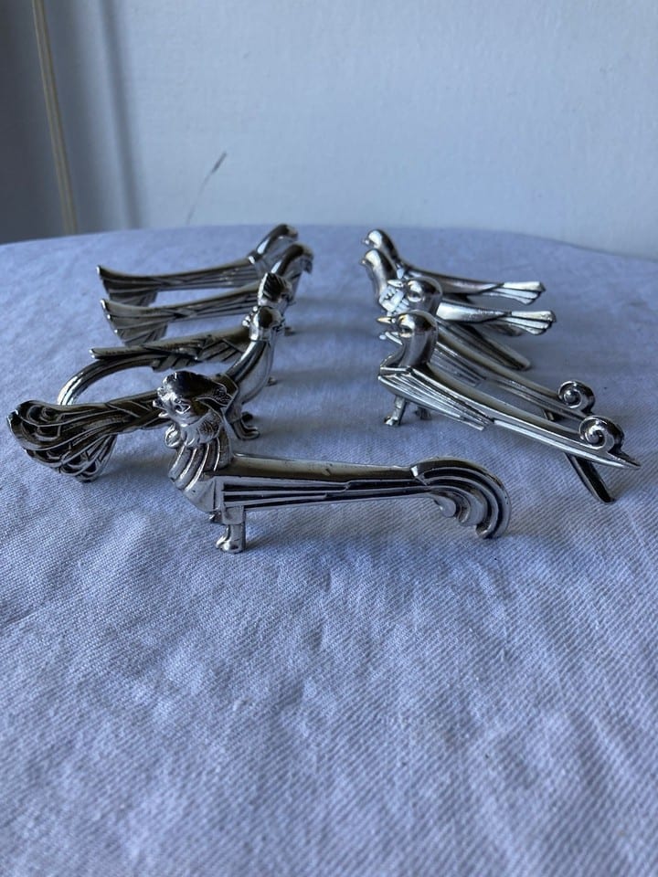 9 porte-couteaux, zoomorphes, Art Deco, dlg Sandoz, en régule chromé