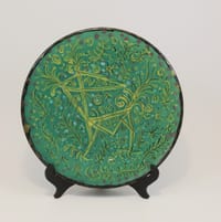 Plat céramique signé Yvain pour Keraluc Quimper décor animal stylisé